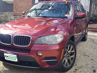 Red BMW repaired after windshield replacement