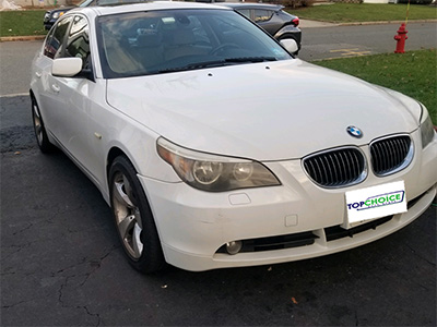 White luxury BMW front windshield repair after replacement by our techs